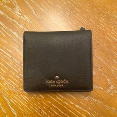 Kate Spade Wallet, Serenade Cove Street, Black Great For Travel Or Everyday Use! Black Leather Kate Spade Wallets, Compact Black Coin Purse For Everyday, Kate Spade Bifold Coin Purse, Kate Spade Black Rectangular Wallet, Kate Spade Black Leather Wallet, Kate Spade Compact Wallet For Everyday, Kate Spade Black Wallet With Interior Card Slots, Kate Spade Compact Everyday Wallet, Black Bifold Wallet With Removable Pouch