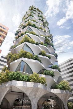 a very tall building with plants growing on it's sides