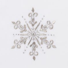 a snowflake is shown on a white surface