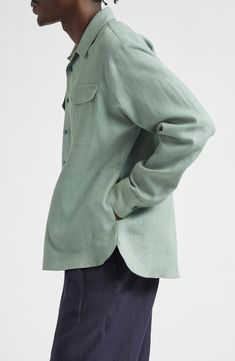 Inspired by a vintage workwear style found at the Saint-Ouen flea market in Paris, this relaxed-fit overshirt is crafted of linen that's been botanically dyed. 30" length; 48" chest (size 48 EU) Front button closure Spread collar Button cuffs Chest flap-patch pockets 100% linen Dry clean or hand wash, line dry Made in France Designer Clothing Vintage Linen Shirt With Relaxed Fit, Vintage Linen Tops With Relaxed Fit, Green Work Shirt With Patch Pockets, Green Workwear Tops With Flap Pockets, Vintage Linen Top With Relaxed Fit, Green Tops With Flap Pockets For Work, Green Top With Lapel Collar And Pockets, Green Tops With Lapel Collar And Pockets, Green Tops With Pockets And Lapel Collar