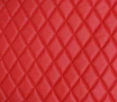 a red quilted leather texture with diamond design on the top and bottom half of it