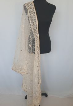 Rich,elegant ,attractive premium Dupatta with overall Chikankari work to enhance your beauty and to compliment your ethnic attire.Dupatta has gold piping border and has golden soft micro sequins  attached and has gold embroidery work . Color Off white Length 2.4 metres Fabric Net Elegant Off White Traditional Wear With Sheer Dupatta, Off White Salwar Kameez With Sheer Dupatta For Diwali, Off White Chanderi Churidar With Traditional Drape, Off White Chanderi Salwar Kameez With Traditional Drape, Off-white Chanderi Salwar Kameez With Traditional Drape, Semi-stitched Cream Anarkali Set With Dupatta, Traditional Cream Churidar With Sheer Dupatta, Cream Semi-stitched Anarkali Set With Dupatta, Traditional Beige Wear With Sheer Dupatta