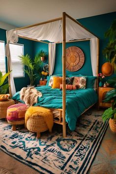 a bedroom decorated in teal and gold with a canopy bed surrounded by potted plants