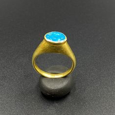 The Beautiful Gold Ring Probably From Ancient Greek's Time With Turquoise Color Blue Glass Stamp. A Beautiful Head Of A Man Figure Engraved On This Blue Glass. Seals Was Mostly Carved In Carnelian Or Garnet In Ancient Times But On Glass Very Rare. We Can Provide Gold Certificate On Customers Request.18 Karat Gold. We Provide Fast And Free Shipping World Wide. Luxury Blue Oval Cabochon Turquoise Ring, Luxury Blue Turquoise Ring For Formal Occasions, Blue Cabochon Fine Jewelry Ring, Blue Cabochon Ring In Fine Jewelry Style, Fine Jewelry Blue Cabochon Ring, Blue Cabochon Signet Ring For Anniversary, Luxury Blue Oval Cabochon Ring, Luxury Blue Signet Ring, Luxury Blue Ring With Oval Cabochon