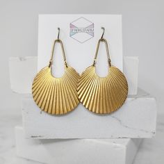 Fresh statement earrings that combine fanned brass crescents and curved brass bars. Brass will have a patina to it, adding to its charm. Also available in smaller size (pictured). ► DETAILS: Dimensions: 2 5/8 inches from top to bottom (6.5 cm) Materials: Raw brass arcs, brass bars, brass hooks (nickel free) Packaging: Arrives in a cute box for safe shipping and gift-giving ► ALL OF MY JEWELRY: SPARKLEFARM.etsy.com ► SHIPPING: Shipping is FREE in the US! I ship within 3 business days and a tracki Bronze Crescent Brass Earrings, Matte Gold Brass Earrings, Brass Hooks, Earrings Art Deco, Earrings Art, Brass Hook, Cute Box, Art Deco Earrings, Earrings Boho