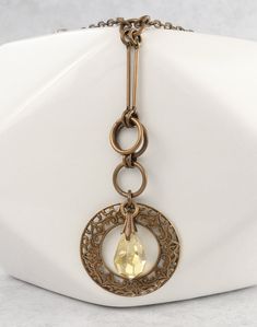 Antique Gold Metal Jewelry, Gold Metal Crystal Necklace, Gold Metal Round Crystal Necklace, Nickel-free Antique Gold Metal Jewelry, Metal Long Dangle Necklace As A Gift, Metal Dangle Long Necklace For Gift, Bronze Chain Jewelry For Jewelry Making, Dangle Long Metal Necklace As Gift, Metal Long Necklace With Round Pendant As Gift