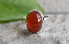 Handmade design ring all ring sizes available >>stone name=natural carnelian >>stone size=13mm length 9mm width 925 silver ring handmade ring (you will get exact item that you see in the photo) the images are not edited all images are genuine. if u any question for item please feel free and contact me. we are very happy to help you. important note------ #we shipped your item 1-3 business days #item delivery time-2-3 weeks. thank you. Oval Carnelian Moonstone Ring For Anniversary, Oval Carnelian Orange Ring, Oval Orange Carnelian Rings, Orange Oval Carnelian Rings, Polished Carnelian Oval Rings, Carnelian Gemstone Rings In Oval Cabochon Shape, Orange Carnelian, Carnelian Ring, Carnelian Stone