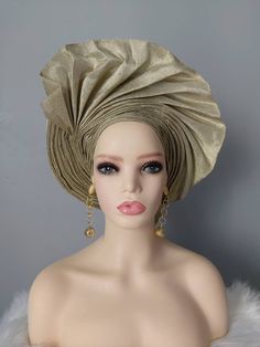 Material: Aso Oke Colour: Champagne Gold This beautiful ready to wear Nigerian head tie can be rocked to any party or special occasion. This headwrap will be a perfect gift idea. Please note colour may appear slightly different from physical product due to image capture settings. You can check our store for various beautiful items. https://www.etsy.com/uk/shop/YettyPrizesTextile Thanks for visiting our shop! Bohemian Party Headband Headwrap, Bohemian Headwrap Headband For Party, Adjustable Gold Headscarf For Party, Traditional Fitted Turban For Party, Gold Turban Headband For Party, Gold Turban Style Headband For Party, Fitted Headscarf For Wedding, Gold Headwrap Headband For Party, Fitted Headband Headscarf For Party