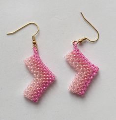 beaded earrings pink beaded earrings ombre pink colours pale to bubblegum chevron shaped arrow shaped unusual girly pink  A pair of beaded earrings in pink. These beaded earrings have an ombre colour change to them, the pink colours change from  pale to bubblegum pink throughout the chevron shaped earrings.  Or they could be direction arrow shaped. You decide! Either way they are unusual and very girly pink Direction Arrow, Pink Beaded Earrings, Ombre Colour, Ombre Pink, Pretty Bracelets, Earrings Pink, Ombre Color, Delica Beads, Pink Ombre