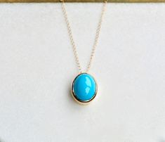 This gorgeous pendant is made with 18k gold and has a bezel set genuine sleeping beauty turquoise stone. Size : 12x8mm Chain Length : choose from dropdown Material : 18k Gold Gemstone : Turquoise See other items from my store here https://www.etsy.com/shop/GalantaJewels?ref=hdr_shop_menu Packaging : All products purchased from us come in a gift box. If you need to include a message, kindly leave us a note when purchasing. Care Recommendations: When not in use, keep earrings enclosed in a box or Yellow Gold Oval Turquoise Necklace Gift, Oval Turquoise Necklace In Yellow Gold As Gift, Oval Yellow Gold Turquoise Necklace As Gift, Sleeping Beauty Turquoise Jewelry, December Birthstone Necklace, Blue Turquoise Necklace, Turquoise Pendant Necklace, Jewelry Blue, Sleeping Beauty Turquoise