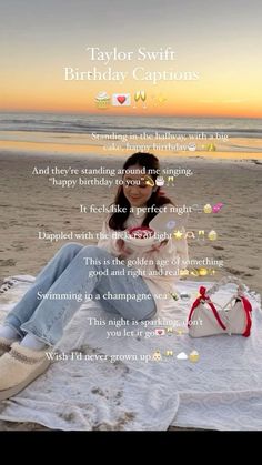 a woman sitting on top of a white blanket next to the ocean with words written in front of her