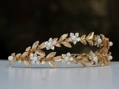 A bridal leaf crown you can easily placed on your hair and suit varied hair styles. made of silver or 14K gold plated on brass. *Could be requested in silver or gold plating* **The shipping arrives between 8-10 days where priority registered mail is available (EU, US, Canada, and more is shipped priority) ** You can upgrade to EMS shipping option to speed up delivery time to 3-4 days Materials: Gold plating, silver plating, brass Back to my shop: https://www.etsy.com/shop/sigalshakkedjewelry If Greek Tiara, Greek Goddess Crown, Angel Crown, Laurel Wreath Crown, Gold Laurel Wreath, Gold Leaf Crown, Gold Leaf Headband, Laurel Crown, Crown Aesthetic