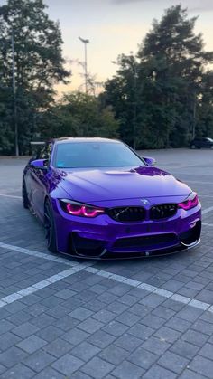 a purple car parked in a parking lot