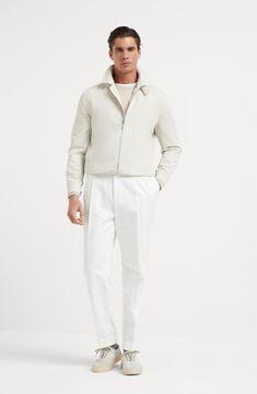 The combination of the cotton fibers with a small percentage of synthetic fibers makes the fabric fine and lightweight, but also resistant and ideal for providing protection during the summer months. The slightly shiny effect of the texture enhances the season's nuances and adds a sophisticated touch to the garment. Two-way zip closure Shirt-style collar Hand pockets with snap Adjustable button cuffs Elasticized hem Cupro lining Two interior pockets with button closure and pen holder Modern Long Sleeve Track Jacket For Spring, Luxury Long Sleeve Cotton Outerwear, Luxury Cotton Outerwear With Pockets, Classic Cotton Track Jacket For Spring, Classic Spring Cotton Track Jacket, Modern Cotton Outerwear With Ribbed Cuffs, Luxury Cotton Outerwear For Spring, Modern Tailored Cotton Outerwear, Modern White Cotton Outerwear