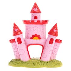 a pink castle with lots of windows and turrets