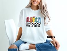 Comfort Colors® ABCD Back to School Shirt, 1st day of school Teacher Team shirt, Kindergarten Teacher, Elementary School Outfit, Teacher Gift PRODUCT SPECS: Comfort Colors Description 6.1 oz./yd² (US), 10 oz/L yd (CA), 100% ring-spun cotton, 30 singles Garment dyed for that lived in feel and almost no shrinkage at home. Soft ring-spun cotton fabric with 100% cotton threads Relaxed fit Topstitched, classic width, rib collar Shoulder to shoulder twill tape Signature twill label Unisex Crewneck Shi White Tops For Teacher Appreciation Back To School, White Top With Name Print For Back To School, White Tops With Name Print For Back To School, White Name Print Top For Back To School, White Text Print Top For Back To School, White Back To School T-shirt For College, White School Spirit T-shirt For Back To School, White Casual Tops For School Events, Casual White Tops For School Events