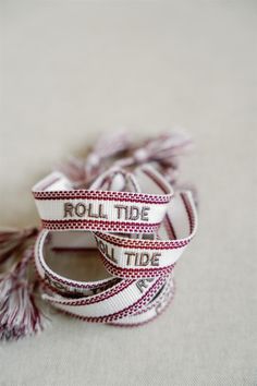 OFFICIALLY LICENSED BY THE UNIVERSITY OF ALABAMA This "Roll Tide" crimson and white bracelet is perfect in the friendship bracelet era! The bracelet has easy adjustable ties and fringe tassels. The University Of Alabama, White Bracelet, The Friendship, Woven Bracelet, White Bracelets, University Of Alabama, Roll Tide, Tassel Fringe, Friendship Bracelet