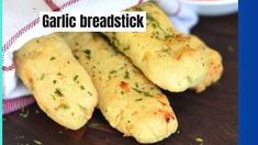 garlic breadsticks are sitting on a table