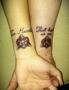 two people are holding hands with tattoos on their arms and one has the words, love is