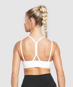 IT’S NOT YOU, IT’S YOUR SPORTS BRA With lightweight, breathable designs, comfortable cups and supportive straps, you can rely on our sports bras to be there for you, and for yours. • Cute double strap feature• Removable padding lets you to wear it how you want• Light V-neck• Stay-put elasticated underband SIZE & FIT• Medium support• Body fit• Model is 5’8” and wears a size XS MATERIALS & CARE• 78% Polyester , 22% Elastane SKU: B8A6A-WB57 White Sports Bra, Sports Bras, Body Fit, Fitness Models, Sports Bra, V Neck, Bra, Sports, How To Wear