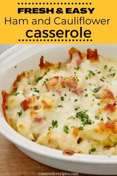 a casserole dish with ham and cauliflower in it on a wooden table