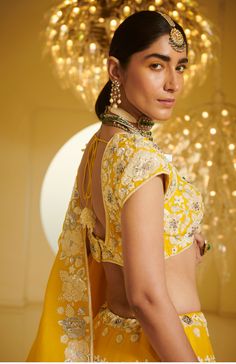 Editor's Note Featuring a lehenga set carrying resham thread work, heavy embellishments of pearls, sequins, stones and cutdana Fabric: Modal Dupion; Organza Color: Yellow Care: Dry Clean Only About the Designer Varun’s work marries the beauty of heritage Indian handcrafted embroideries with a modern colour sensibility. His clothes range from traditional saris and lehenga ensembles to contemporary separates like trousers, tunics, jackets, and dresses. He is known for the lightness of his fabrics Kali Lehenga, Blouse Yoke, Lehenga Dupatta, Personal Shopping Service, Summer Dream, Yellow Fabric, Thread Work, Modern Colors, Lehenga