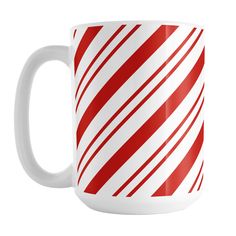 a red and white striped coffee mug on a white background, with diagonal stripes in the middle