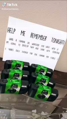 there are many batteries on the shelf with a sign that says help me remember tonight