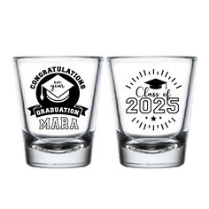 two shot glasses with graduation emblems on the front and back, one is clear