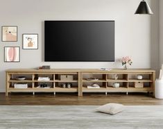 a large flat screen tv mounted to the side of a wall in a living room