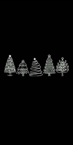 a line of christmas trees on a black background