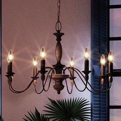 A unique Americana chandelier featuring a rustic bronze finish and six candles hanging in front of a window. Country Chandelier, Indoor Chandelier, Provincial Style, Wood Chandelier, Metal Pendant Light, 5 Light Chandelier, Traditional Chandelier, Rustic Chandelier, Chandelier Style