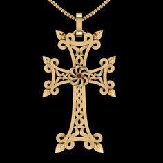 an intricately designed cross pendant on a black background