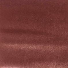 a close up view of a maroon fabric