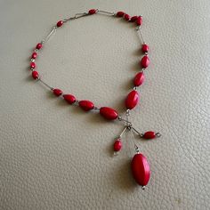 This is a vintage red glass beaded dropper necklace made circa 1930. The necklace is made up of a opalescent red glass oval beads and metal links. There is a hook clasp. Good vintage condition.  Please see photos for more details. Size: 16 inches We have a wide range of antique and vintage items in our shop and will be happy to combine shipping costs. Please take a look at our other items. About Us Classic Brocante is a husband and wife team, Franc and Karen Jackson. We are based in Rugby, Engla Vintage Red Beaded Necklaces With Oval Beads, Adjustable Red Necklaces With Oval Beads, Adjustable Red Necklace With Oval Beads, Vintage Red Necklace With Dangling Beads, Red Vintage Necklace With Dangling Beads, Vintage Red Gemstone Beaded Necklaces, Handmade Red Oval Necklace, Vintage Red Gemstone Beads Jewelry, Red Vintage Jewelry With Gemstone Beads