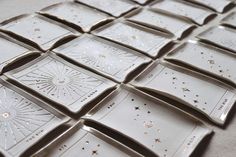 white and gold glass tiles with stars on them