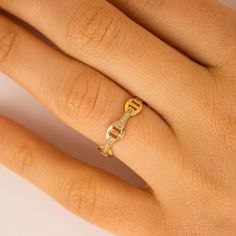 Millie Add a touch of elegance with our Diamond Chain Link Ring, crafted from 14k solid gold. This dainty yet striking ring features a unique chain link design adorned with sparkling diamonds, offering a timeless blend of sophistication and modern style. Perfect for stacking or wearing alone, this diamond band is a versatile and elegant addition to any jewelry collection. - Handmade- Solid Gold- Natural Diamond - G Color, SI Quality Diamonds- Total Diamond Carat Weight: 0.15 ctw- Size of Chain L Elegant Diamond Chain Ring, 14k Gold Chain Ring With Diamond Accents, Elegant 14k Gold Chain Link Ring, Elegant Diamond Chain Link Ring, Elegant Gold Plated Chain Link Ring, Linking Rings, Diamond Chain, Chain Ring, Quality Diamonds