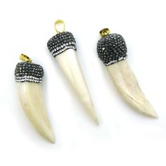 Pave Pendant , Imitation Bone Incisor Pendant, Zircon Pave Long Bone Pendant Stone: Imitation ox bone Pave: Top paved Type: Pendant Bail: Gold plated brass  Pendant Material: Imitation Ox bone * Note: Bone is slightly sharp, not a dulled bone Shape: Elephant tusk, husk, long bone Measurement: 50-60mm long by 11-15mm in thickness Weight: 9-14 grams per piece. SKU#: 292022 Quantity: 1 pendant The last picture shows a small selection of our variety of chains showcasing the pendants. For our en Elephant Tusk, Tusk Pendant, Tusk Necklace, Bone Pendant, Body Adornment, Pendant Bails, The Last Picture Show, Pave Pendant, Crown Ring