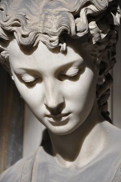 a statue of a woman with her eyes closed