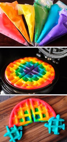 rainbow colored waffles sitting on top of a wooden table next to each other