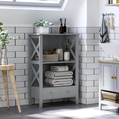 there is a shelf with towels and other items on it in the bathroom next to a sink