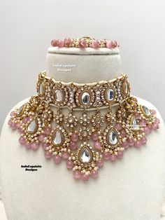 Premium quality elegant Kundan choker comes with Jhumki Earrings with attached saharey and Tikka/ Indian Jewelry/Premium Quality Polki and Kundan Jewelry/bridal necklace/pink  All items are shipped from Brampton, Ontario, Canada. If you need your item by a certain day, please reach out to us for express delivery option before placing the order so that we can update the shipping for you. Standard shipping/delivery timeline Below are the delivery timeline estimates. We dispatch all orders by the n Light Pink Indian Jewellery, Luxury Kundan Bridal Earrings With Intricate Design, Luxury Diwali Choker With Intricate Design, Elegant Luxury Pink Kundan Necklace, Luxury Elegant Pink Kundan Necklace, Luxury Pink Kundan Necklaces, Luxury Pink Kundan Necklace, Pink Stone Work Tikka For Wedding, Pink Bridal Sets For Party And Festive Occasions