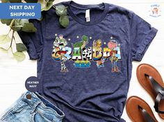 Grandpa Toy Story Shirt, Grandpa Cartoon Shirt, Retro Toy Story Grandpa T-Shirt, Magical Grandpa Tee, Gift For Grandpa ORDERING: 1. Review all photos 2. Choose Size and Color from drop-down menu 3. If personalization box is available, add your text color 4. Add each shirt to cart one at a time 5. Click "Add to Cart" - you can go back to add more products 6. Click "Proceed to Checkout" 7. Add note to seller for any requests * We use several different brand shirts, all of them are premium quality Grandpa Cartoon, Themed Multicolor Tops With Letter Print, Multicolor Cartoon Print Tops For Fan Merchandise, Multicolor Cartoon Print Tops Fan Merchandise, Multicolor Themed Tops With Letter Print, Fun Multicolor Fan Merchandise Tops, Fun Multicolor Fan Merchandise Top, Toy Story Shirt, Cartoon Shirts