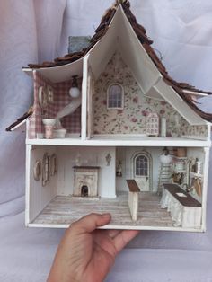 the doll house is made out of cardboard