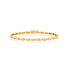 The Small Dome Tennis Bracelet is crafted in polished 18 karat gold and exudes timeless, vintage inspired appeal to create a sophisticated wear-forever look. Whether worn alone, or stacked with other bracelets, this tennis bracelet instantly elevates any look. It's the perfect foundation for your jewelry wardrobe - instantly adding a dose of quiet luxury with minimalist elegance. Bracelet measures 6.5 inches in length Push Clasp Fastening with Safety Made with love in Los Angeles Complimentary g Yellow Gold Oyster Bracelet For Everyday Luxury, Classic Sterling Silver Jubilee Bracelet For Everyday Luxury, Classic Yellow Gold Diamond Bangle Bracelet, Classic White Gold Diamond Bracelet With Oyster Clasp, Timeless Flexible Yellow Gold Bracelet, Classic White Gold Diamond Oyster Bracelet, Classic Sterling Silver Jubilee Bracelet In Yellow Gold, Classic Yellow Gold Sterling Silver Jubilee Bracelet, Elegant Yellow Gold Sterling Silver Jubilee Bracelet