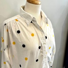 Super cute LizSport white cotton blouse is merrily patterned with black and yellow dots. Gathered yokes, full sleeves that have tabs to roll, and soft 100% cotton. Absolutely wonderful condition.  Measurements:  22" underarm to underarm, laid flat  27" inches long  Please check out my other listings here: https://www.etsy.com/ca/shop/FernwoodFashionista?ref=seller-platform-mcnav Follow me on Instagram, Facebook and Pinterest @fernwoodfashionista for all the latest additions to my shop.   All pro Polka Dot Long Sleeve Shirt For Spring, Polka Dot Cotton Top For Fall, Relaxed Fit Cotton Blouse With Polka Dot, Relaxed Fit Cotton Blouse In Polka Dot, Cotton Polka Dot Blouse With Relaxed Fit, Polka Dot Cotton Shirt For Spring, Polka Dot Cotton Blouse With Relaxed Fit, Spring Polka Dot Cotton Shirt, Spring Cotton Polka Dot Shirt