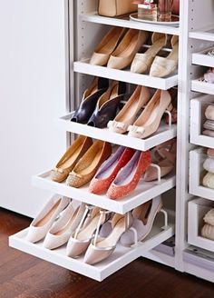 the shoe rack is filled with many pairs of shoes