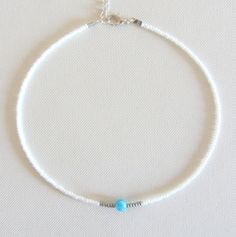 Aquamarine choker bead choker necklace seed bead choker Christmas gift for her beaded choker beach jewelry choker necklace for woman Free shipping is available for orders to the United States, with a purchase of $ 35. This beautiful necklace is made of white, silver beads and one aquamarine (size 6 mm) bead in the middle. Please choose at an order length of necklace. Each choker comes with a 2 inch adjustable extender chain. Turquoise Jewelry With Spacer Beads For Summer, Beaded Strand Jewelry Gift, Minimalist Summer Jewelry With Colorful Beads, Turquoise Gemstone Beads Jewelry For Summer, Turquoise Gemstone Beaded Jewelry For Summer, Summer Turquoise Gemstone Beads Jewelry, Minimalist Handmade Choker For The Beach, Summer Spacer Bead Choker Jewelry, Minimalist Beaded Chain Jewelry For Beach