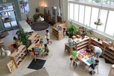 an overhead view of children's playrooms in a large building with lots of windows