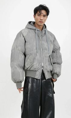 Experience the ultimate blend of comfort and style with our Oversized Mock Two-Piece Hooded Puffer Jacket, designed for the modern man who values both aesthetics and functionality. 

Meticulously crafted from premium cotton cloth with a solid color pattern, this jacket features a hood for added warmth and a distinctive mock two-piece look that exudes a subtle nonchalant vibe. Metal decorations serve as a refined touch to the garment's edgy appeal, while the zipper placket ensures practicality in Urban Streetwear Parka With Padded Collar, Urban Style Parka With Padded Collar For Streetwear, Urban Style Parka With Padded Collar, Urban Parka With Padded Collar For Streetwear, Modern Streetwear Outerwear With Double-lined Hood, Modern Streetwear Parka With Pockets, Hooded Puffer Jacket For Streetwear With Pockets, Modern Oversized Outerwear With Detachable Hood, Modern Winter Parka For Streetwear